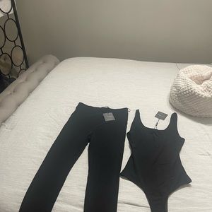 JLUXLABEL : Sheer body con two piece set in black .